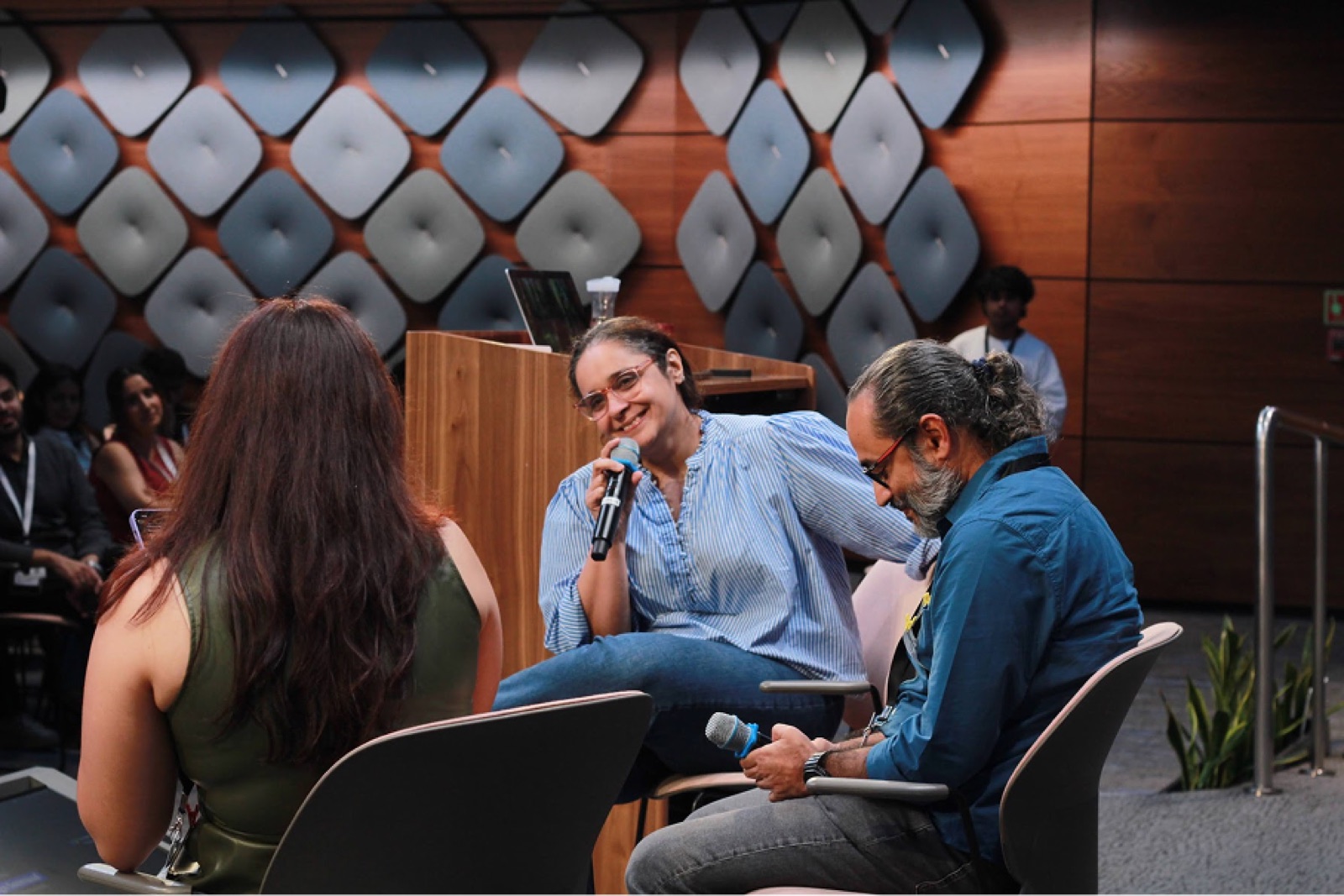 A speaker mid-answer during a panel conversation